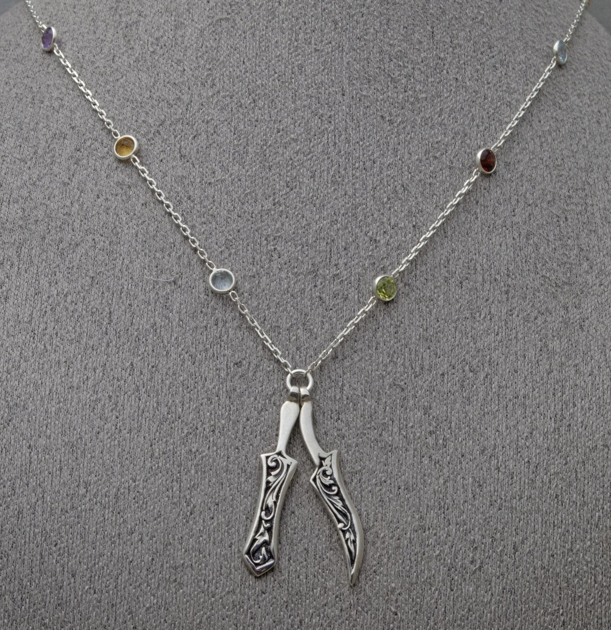 Khanda and Kirpan on faceted gemstone necklace